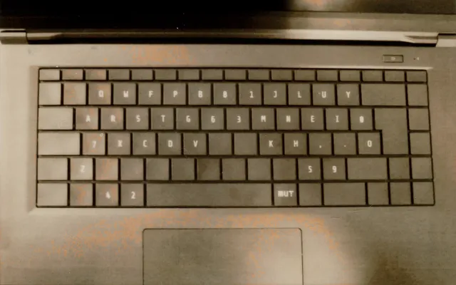 Laptop keyboard with flattened custom splitted Colemak DH layout (a scan of a physical Instax Wide Evo print). Laptop keyboard with flattened custom splitted Colemak DH layout (a scan of a physical Instax Wide Evo print).